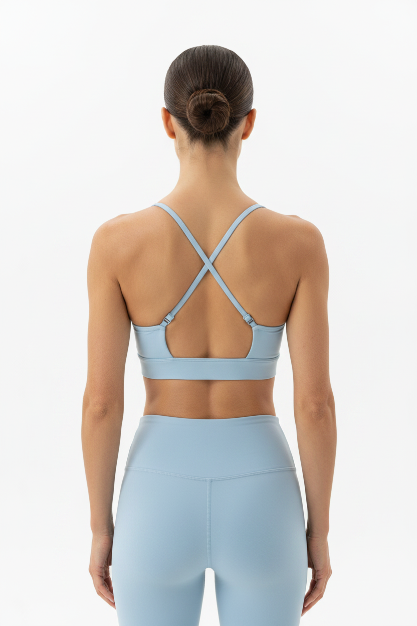 Top deportivo halter azul celeste espalda cruzada con hebillas