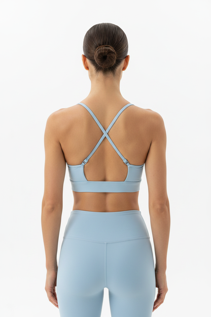 Top deportivo halter azul celeste espalda cruzada con hebillas